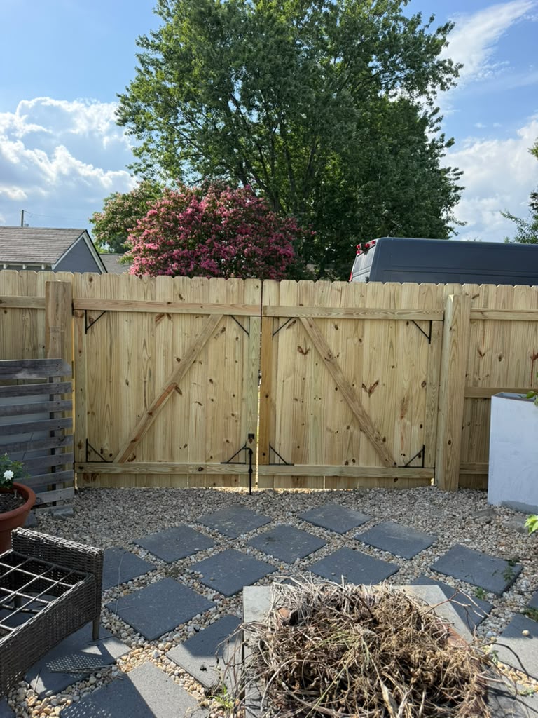 Wood stockade fence installation by ACR Fence